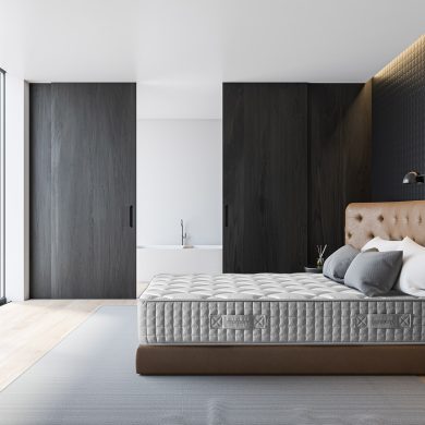 Side view of luxury bedroom with grey geometric pattern walls, wooden floor, comfortable leather king size bed and bathroom with tub and sliding door next to it. 3d rendering